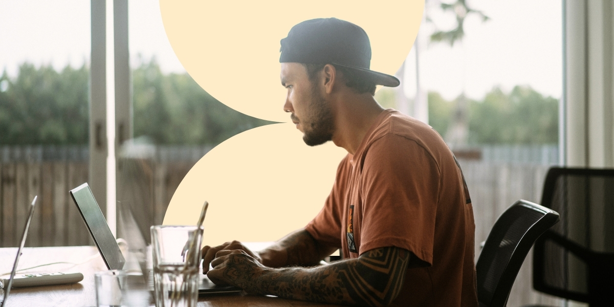 The main image presenting a man sitting and working on his laptop