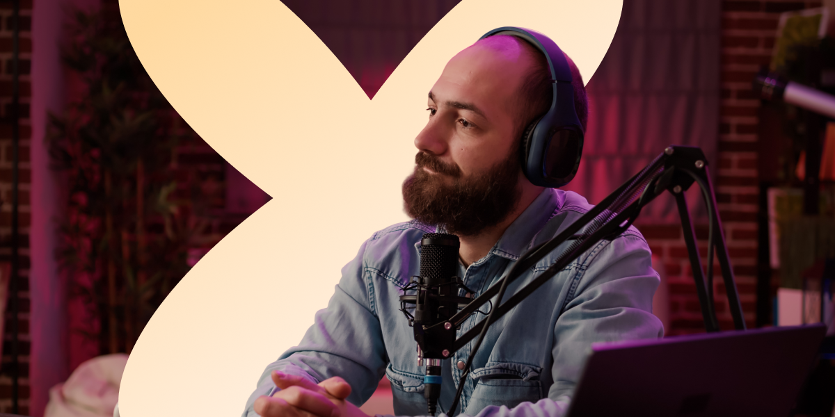 The main image presenting a man with his headphones on, sitting in front of a microphone