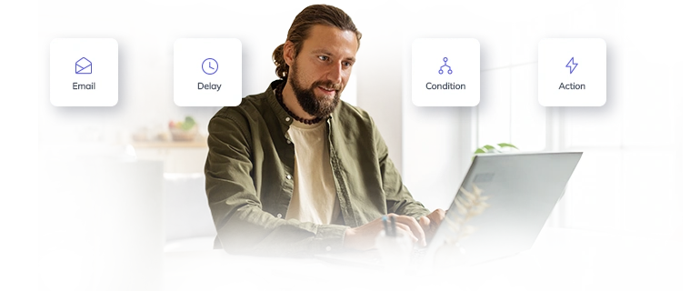 A man discovering email automations capabilities on a laptop