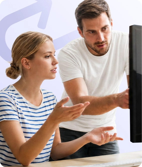 Two people working together at a computer